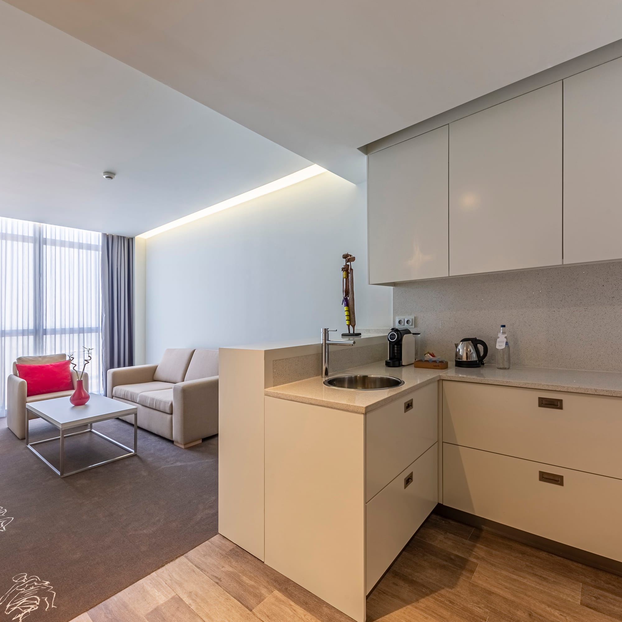 a room with a kitchen and a couch