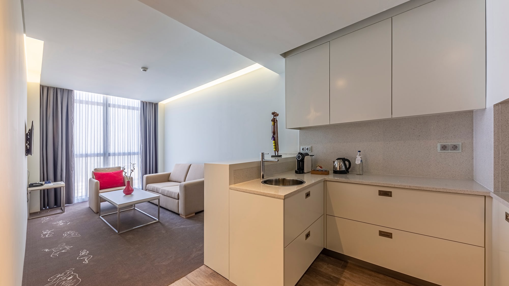 a room with a kitchen and a couch