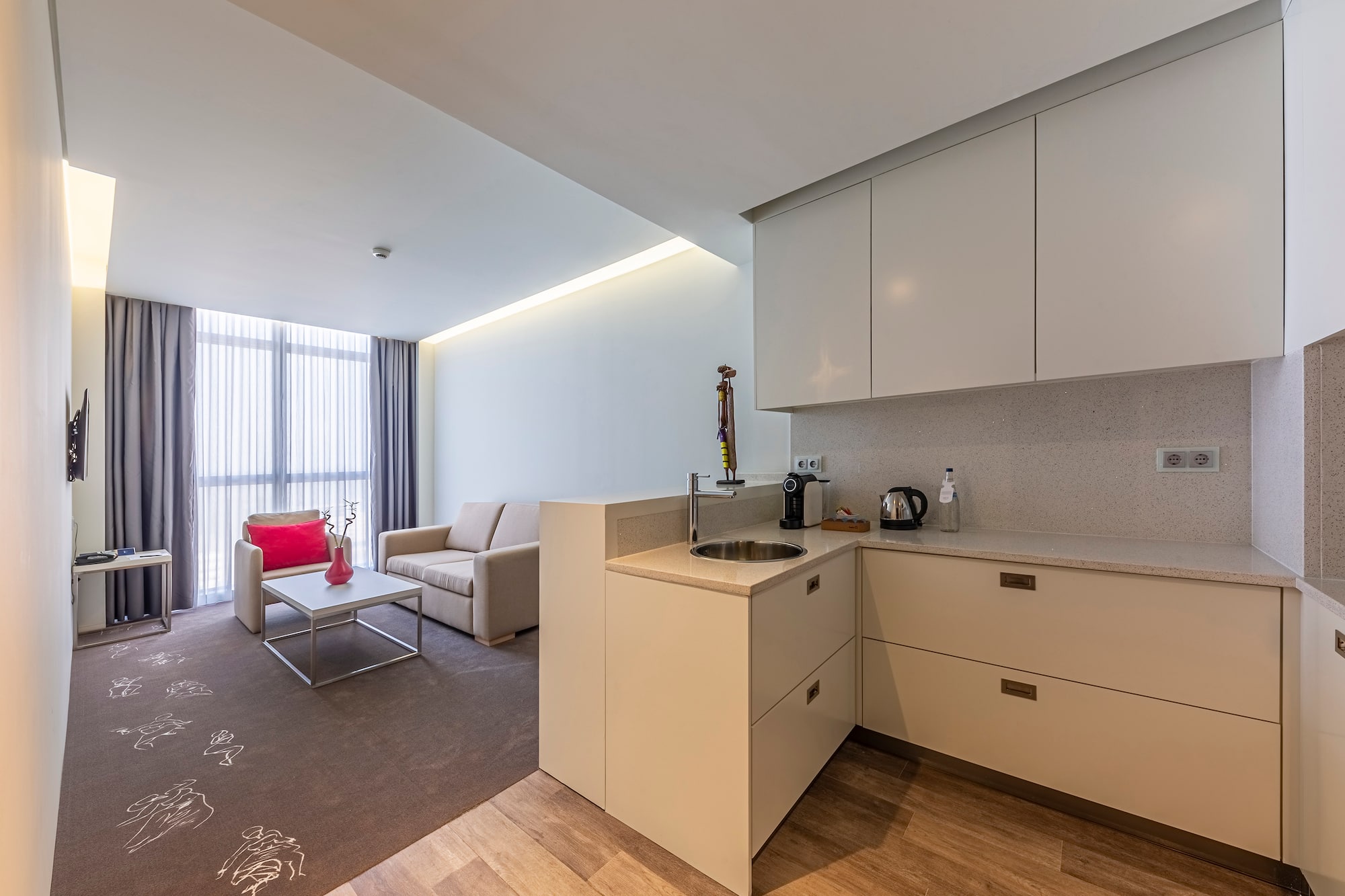 a room with a kitchen and a couch