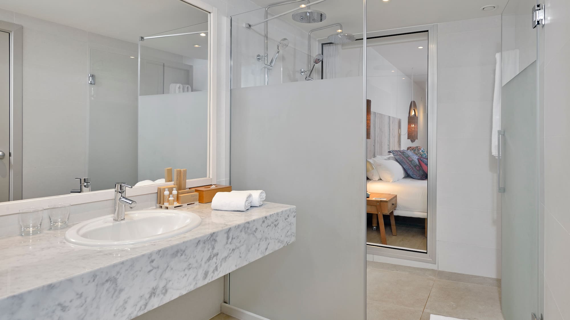 a bathroom with a glass shower door