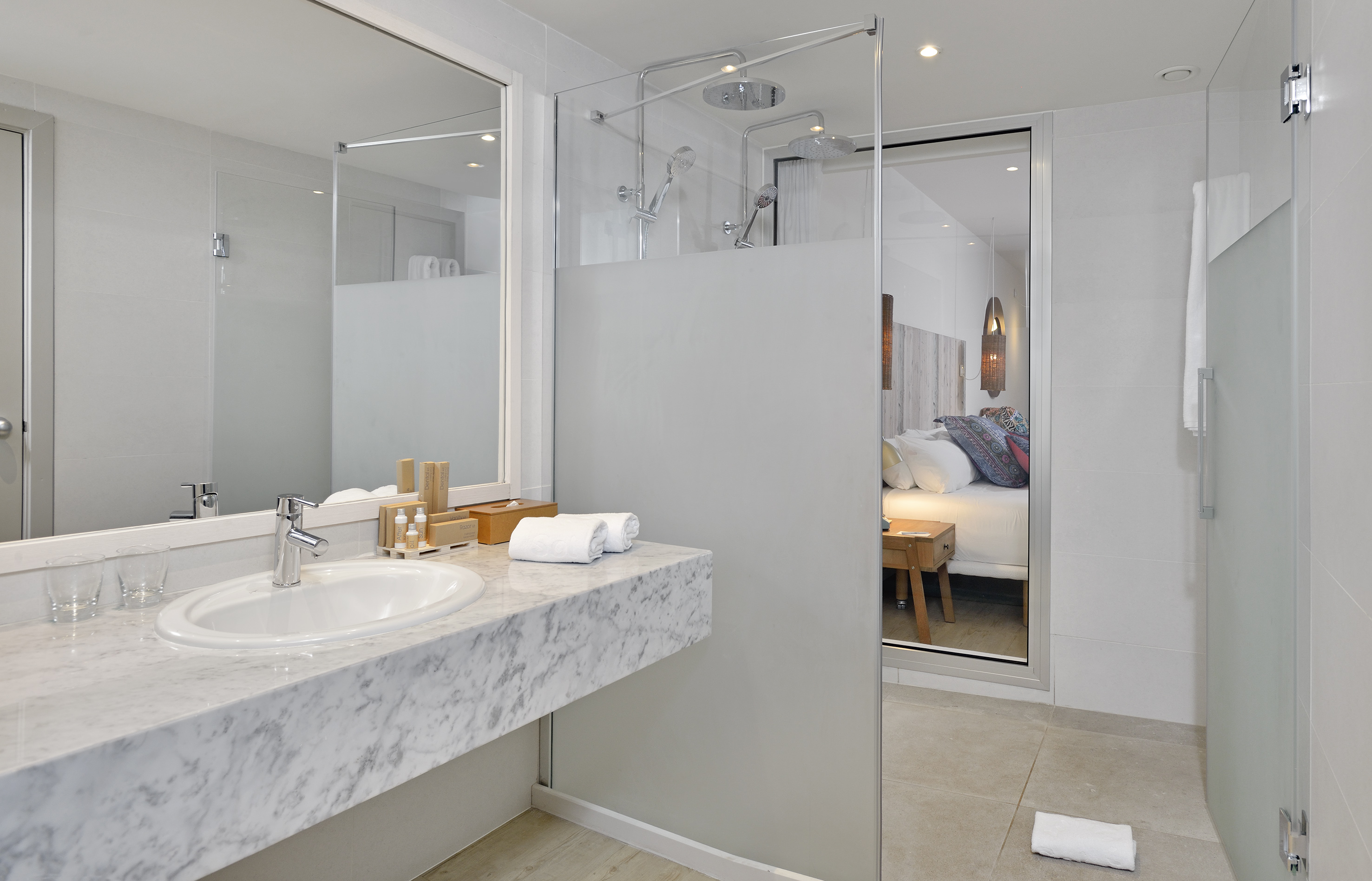 a bathroom with a glass shower door