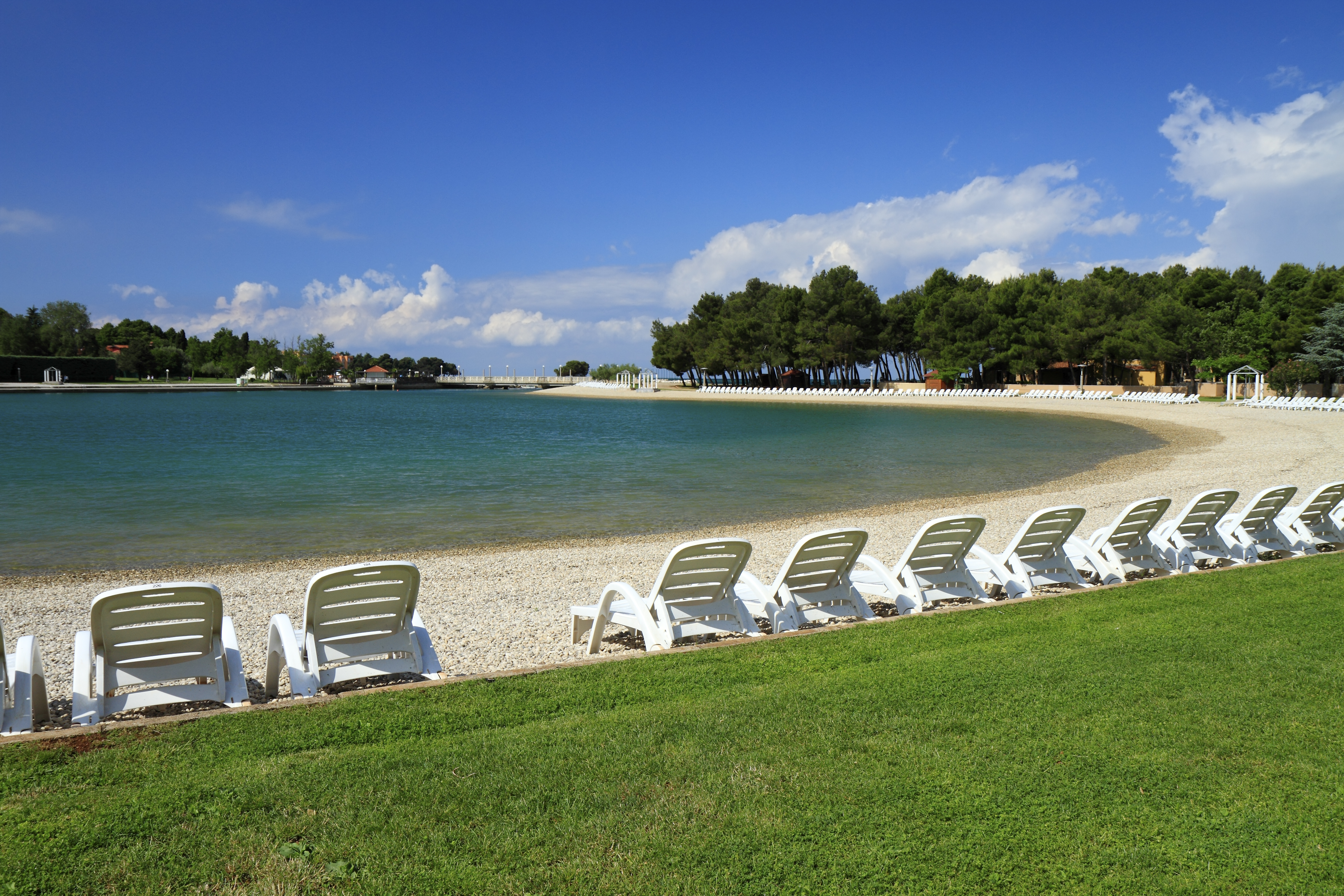 a row of chairs on a beach