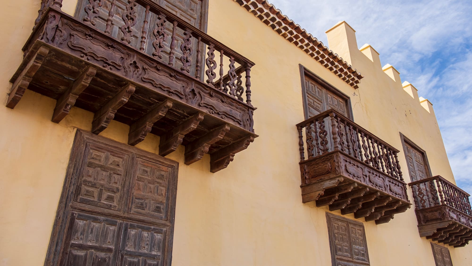 a building with wooden balconies