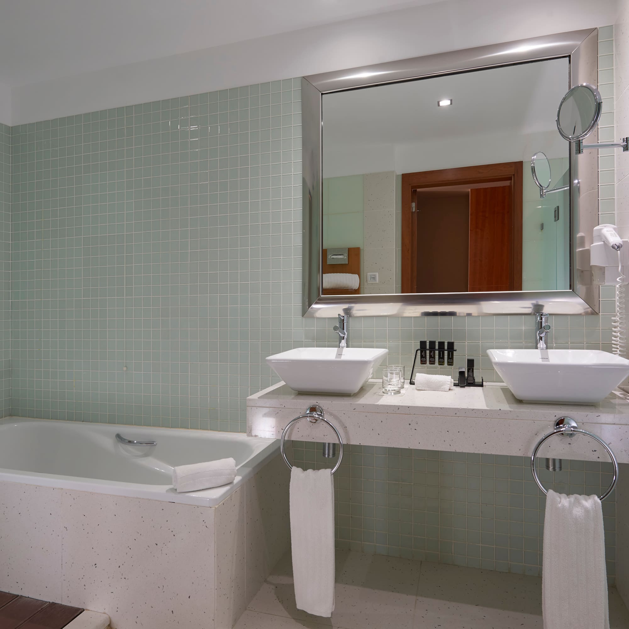 a bathroom with a bathtub and sink