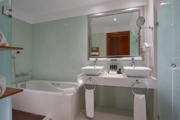 a bathroom with a bathtub and sink