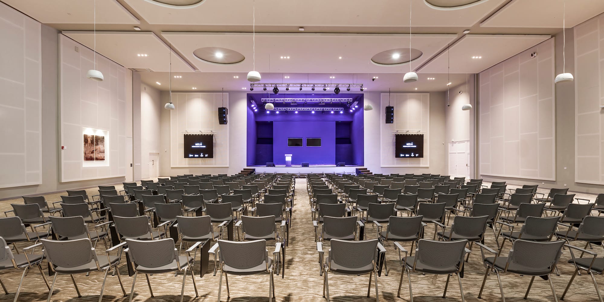 a room with rows of chairs