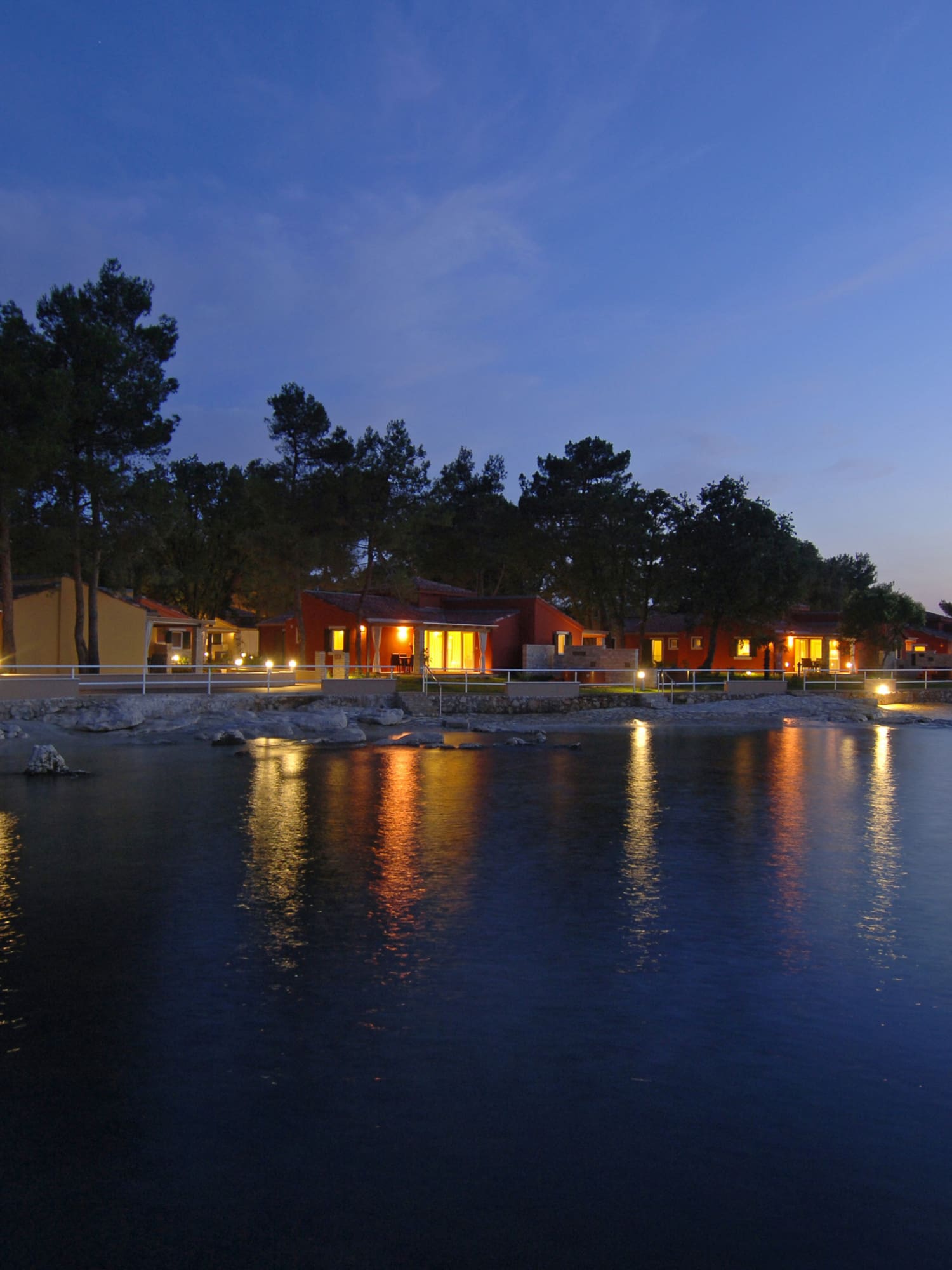 a row of houses by a body of water