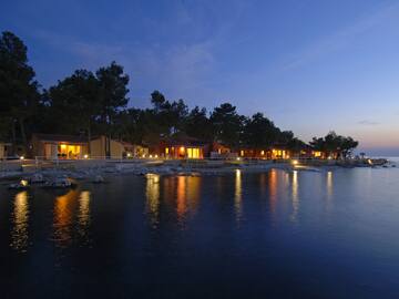 a row of houses by a body of water