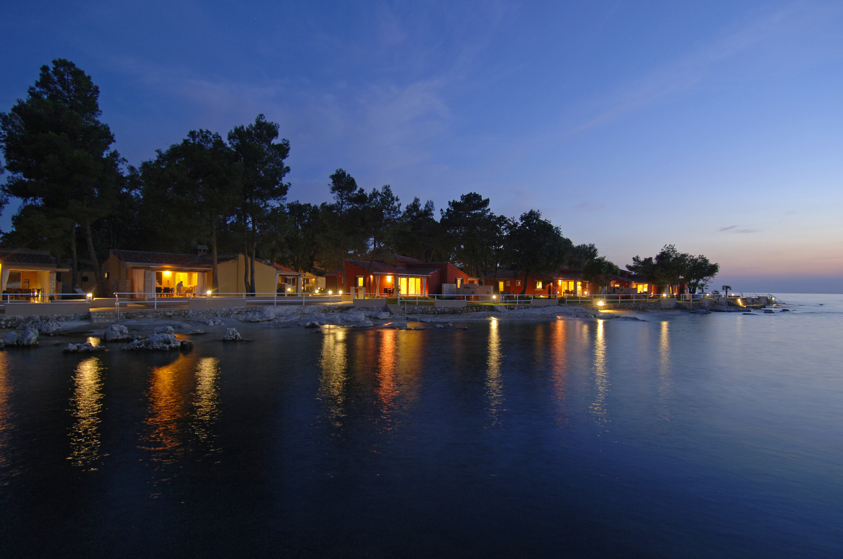 a row of houses by a body of water