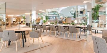 a large room with tables and chairs