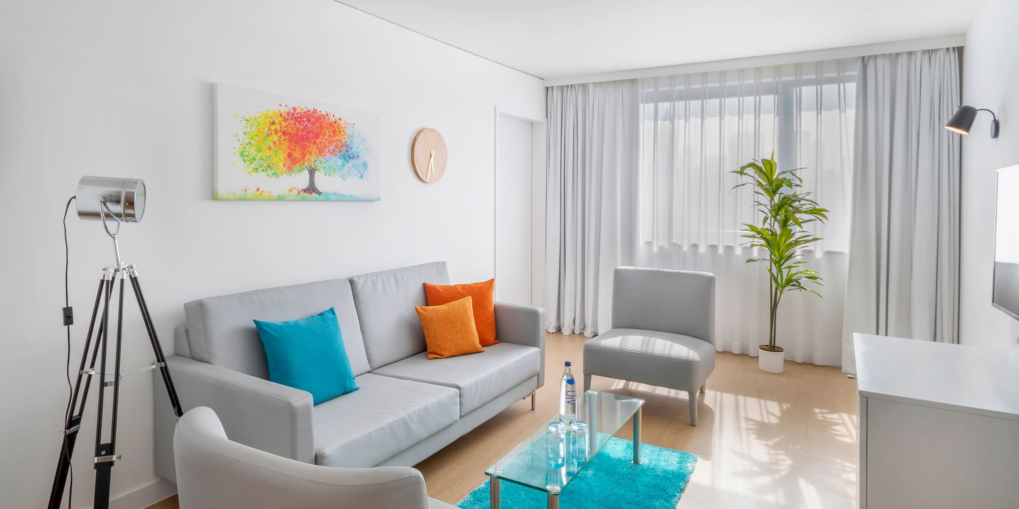 a living room with a couch and chair