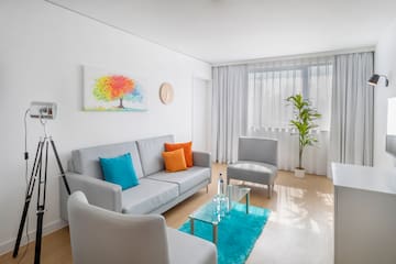 a living room with a couch and chair
