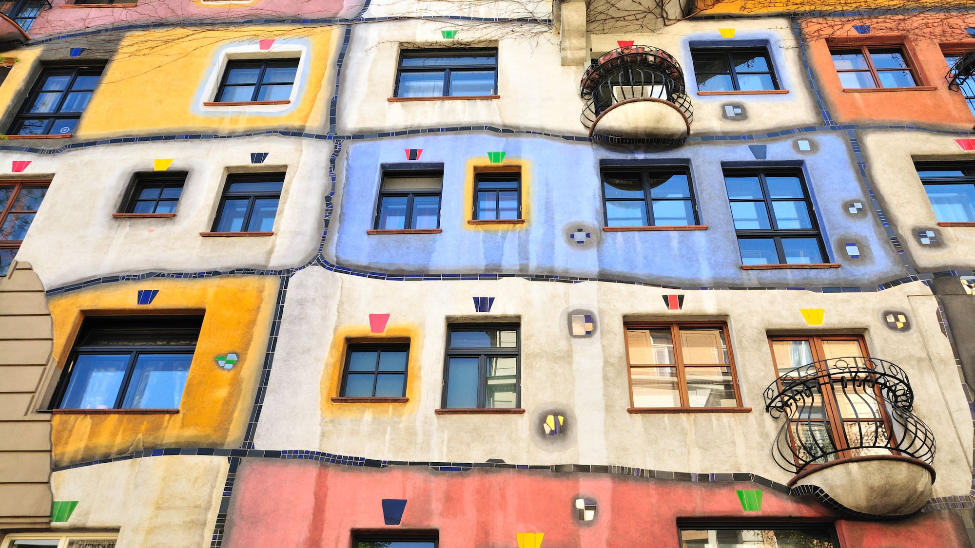 a multi-colored building with many windows