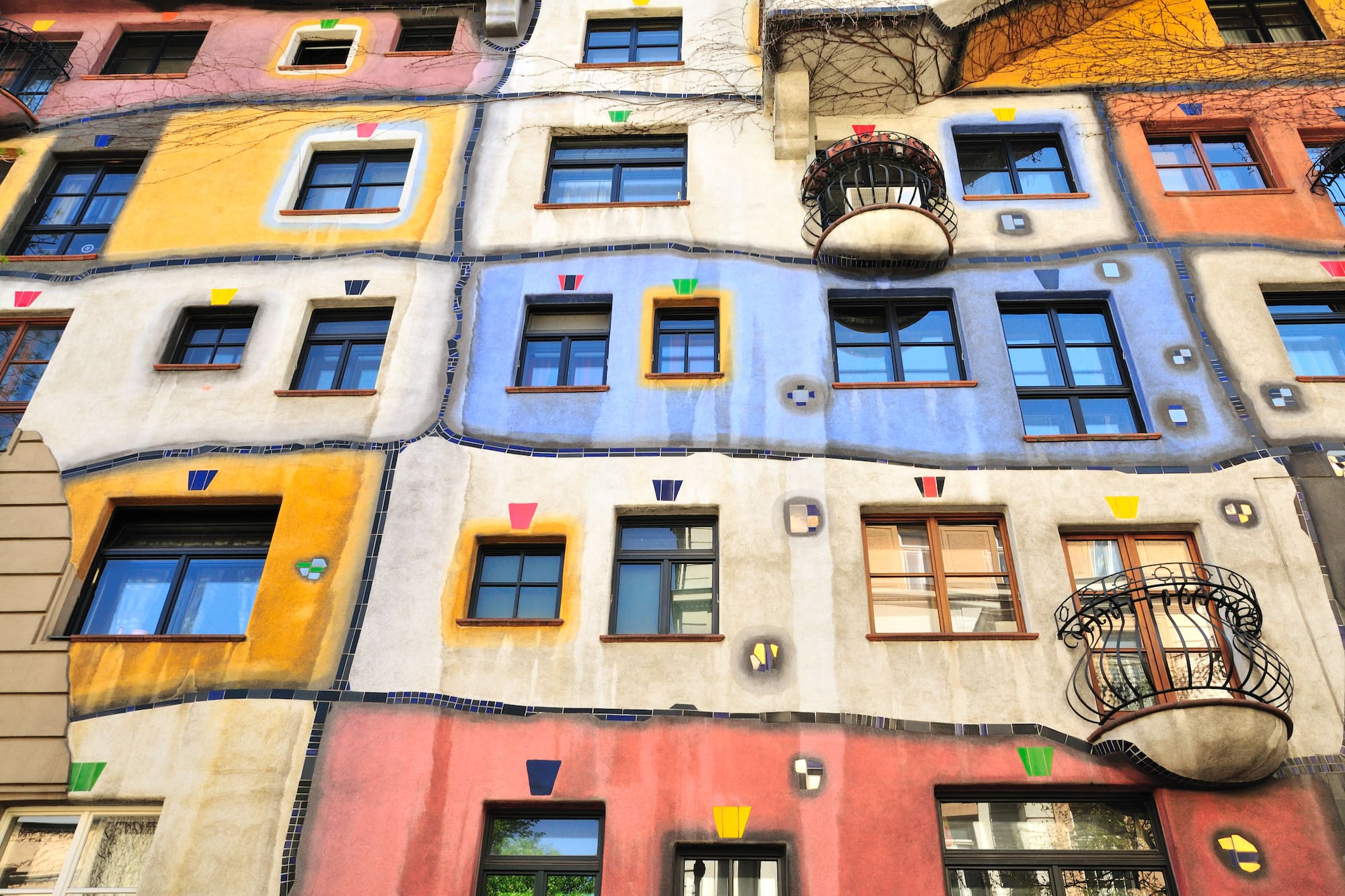 a multi-colored building with many windows