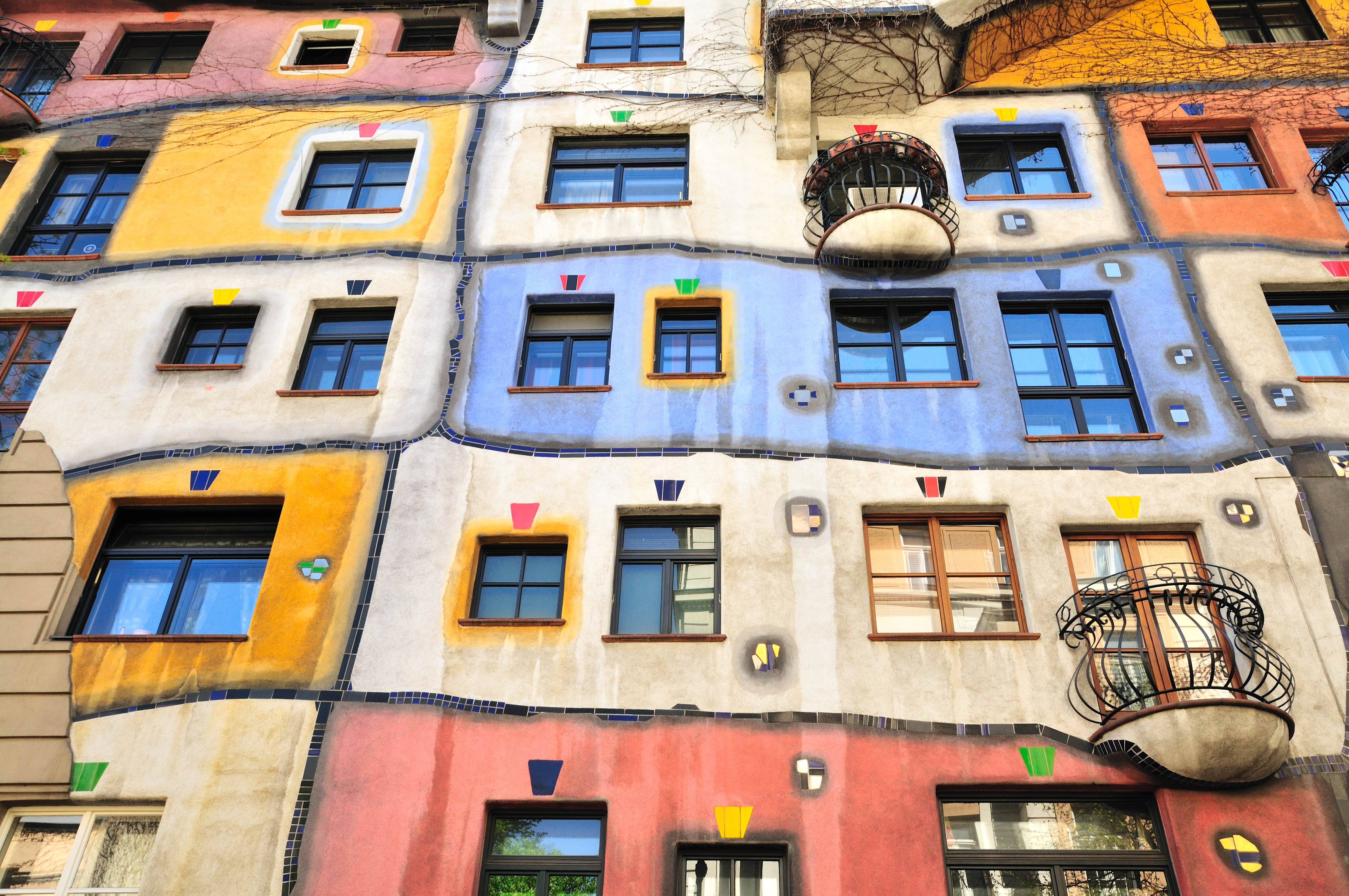 a multi-colored building with many windows