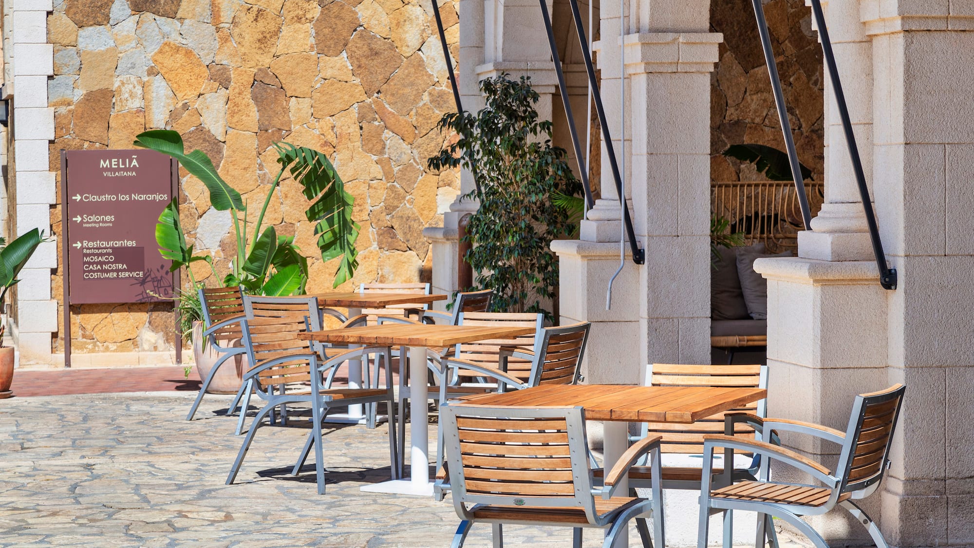 tables and chairs outside a building