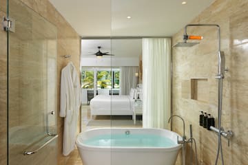 a bathroom with a bathtub and shower