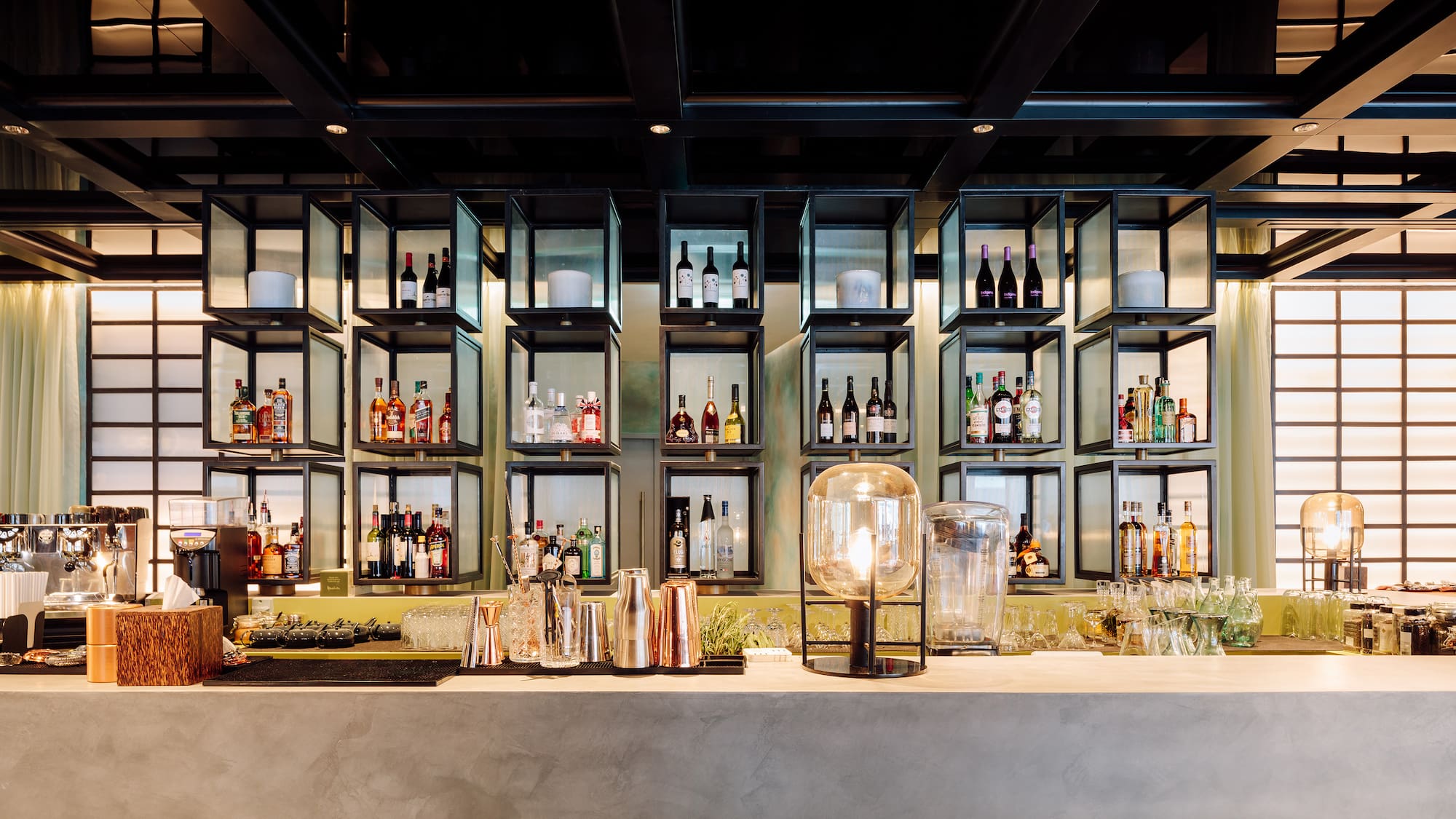 a bar with bottles of alcohol on shelves