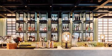 a bar with bottles of alcohol on shelves