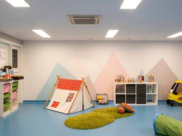 a room with a tent and toys