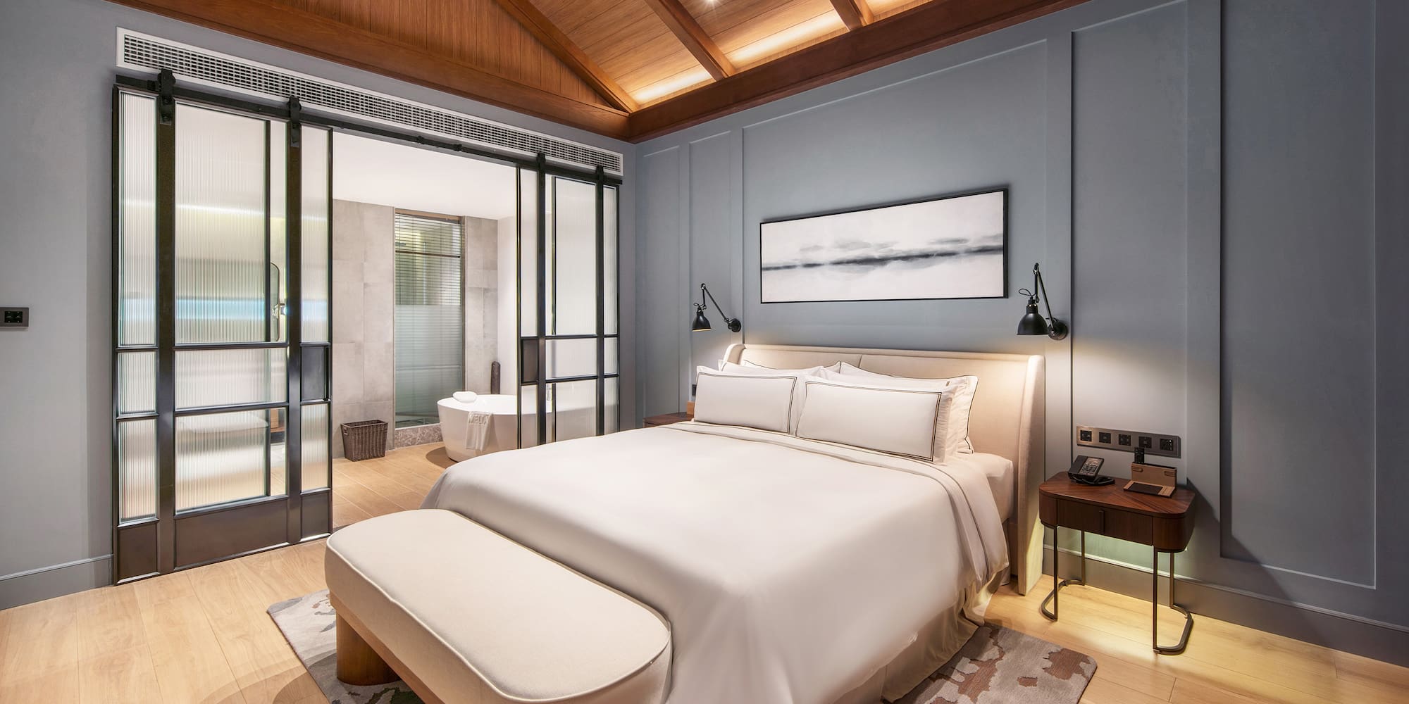 a bedroom with a bed and a bathtub