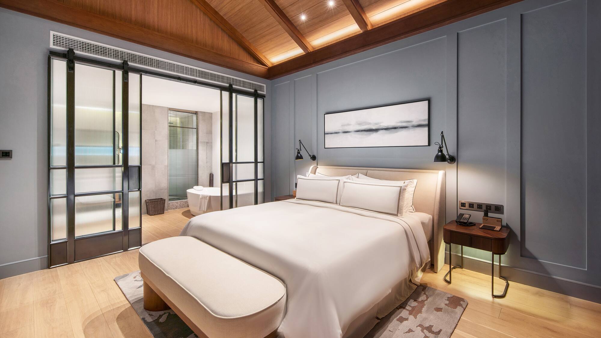 a bedroom with a bed and a bathtub