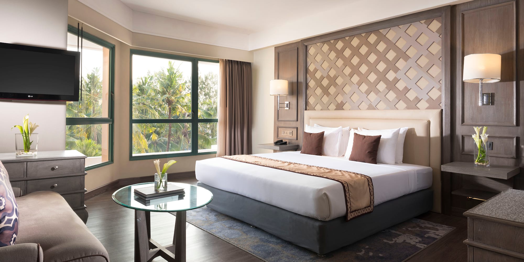 a room with a bed and a television