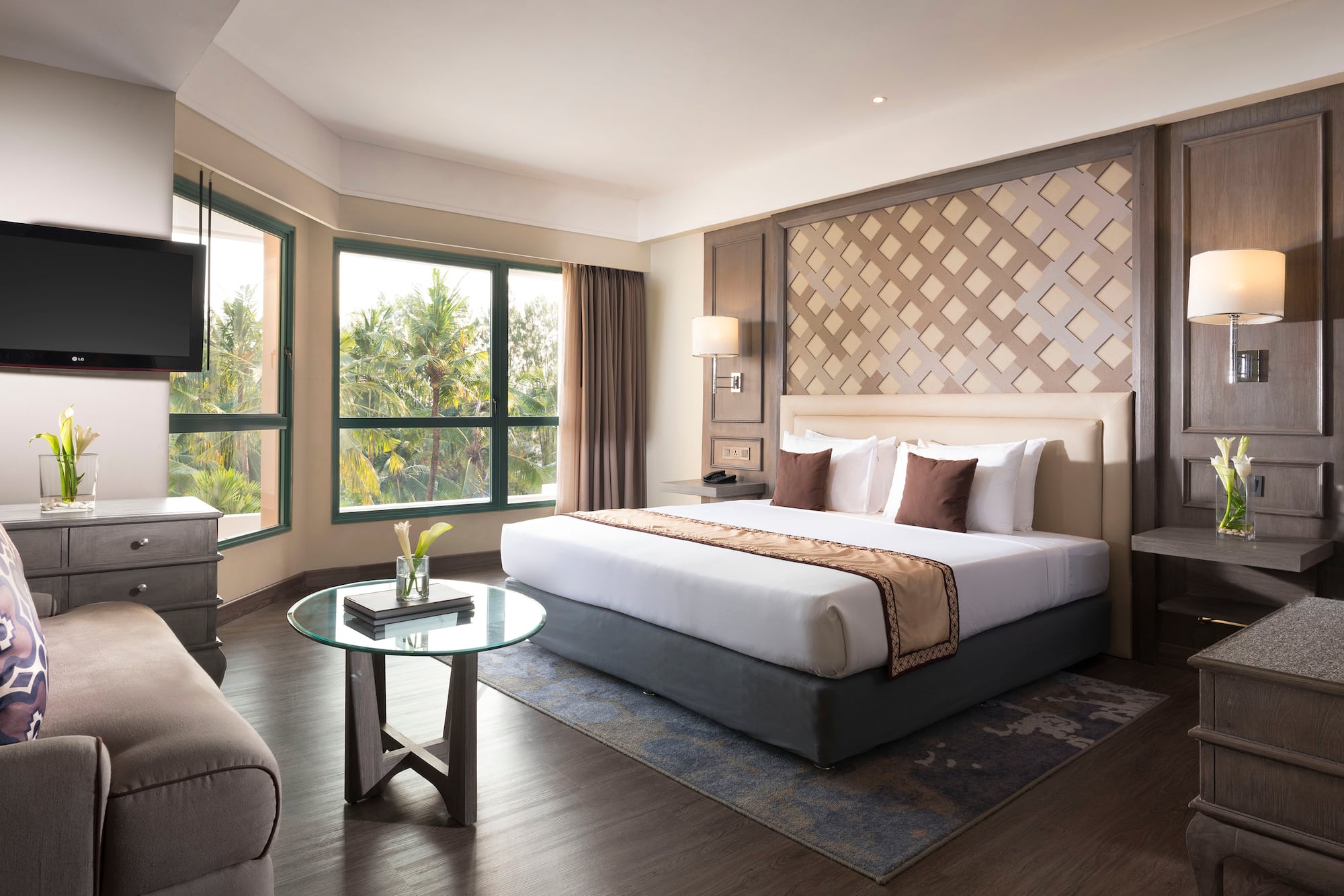 a room with a bed and a television