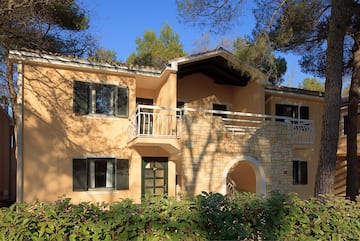 a house with trees in the background