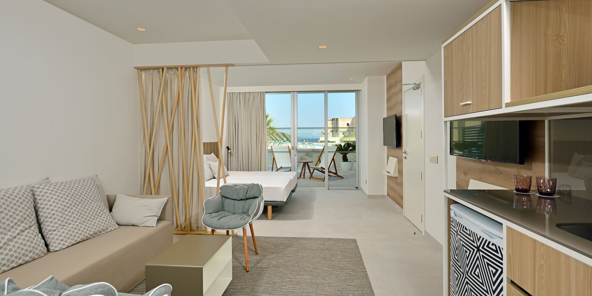 a room with a bed and a television