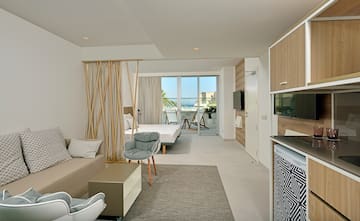 a room with a bed and a television