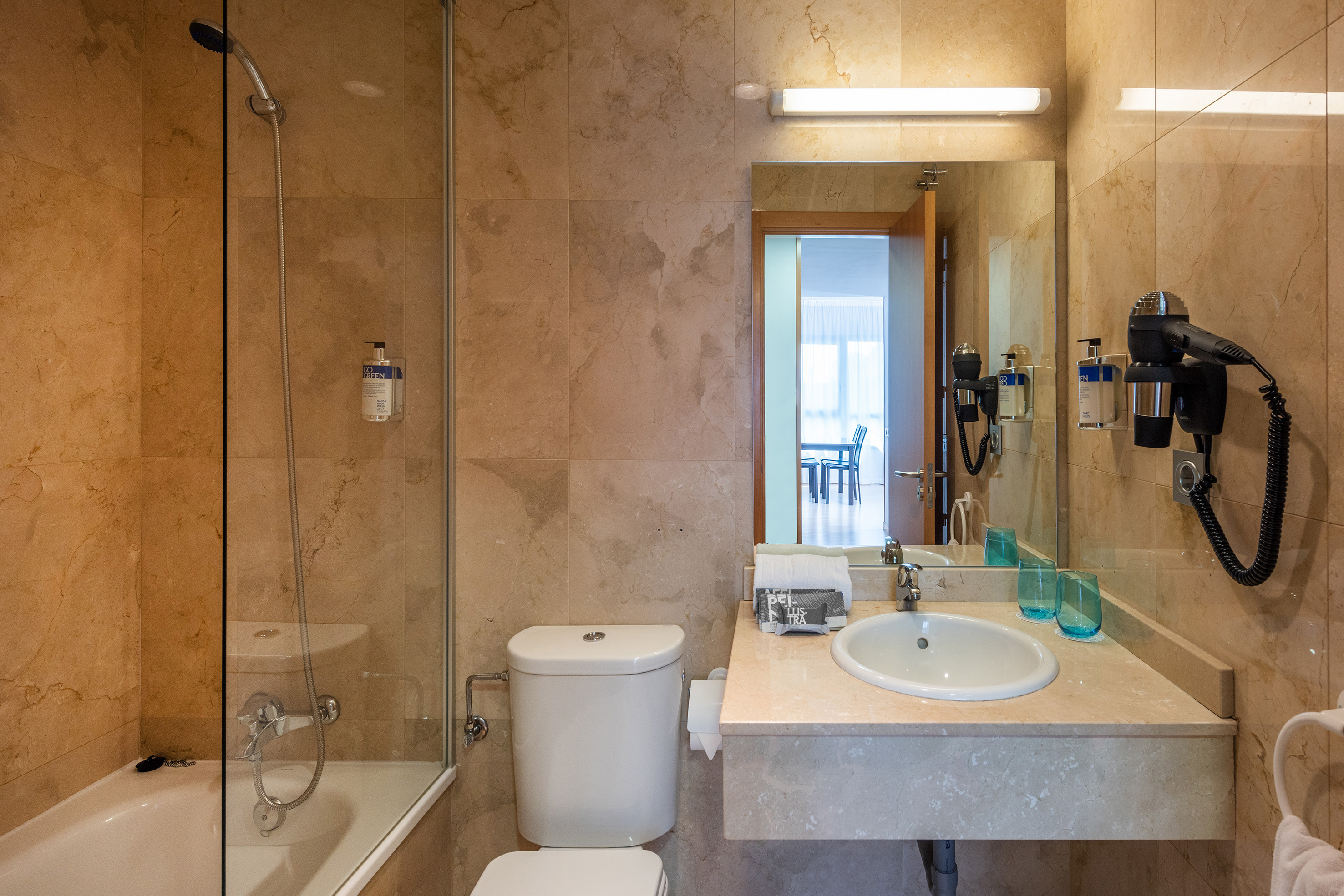 a bathroom with a sink and shower