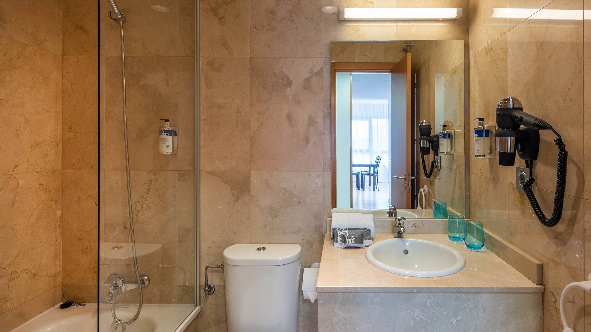 a bathroom with a sink and shower