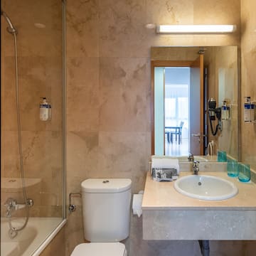 a bathroom with a sink and shower