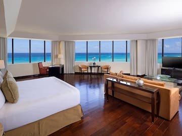 a room with a large window overlooking the ocean