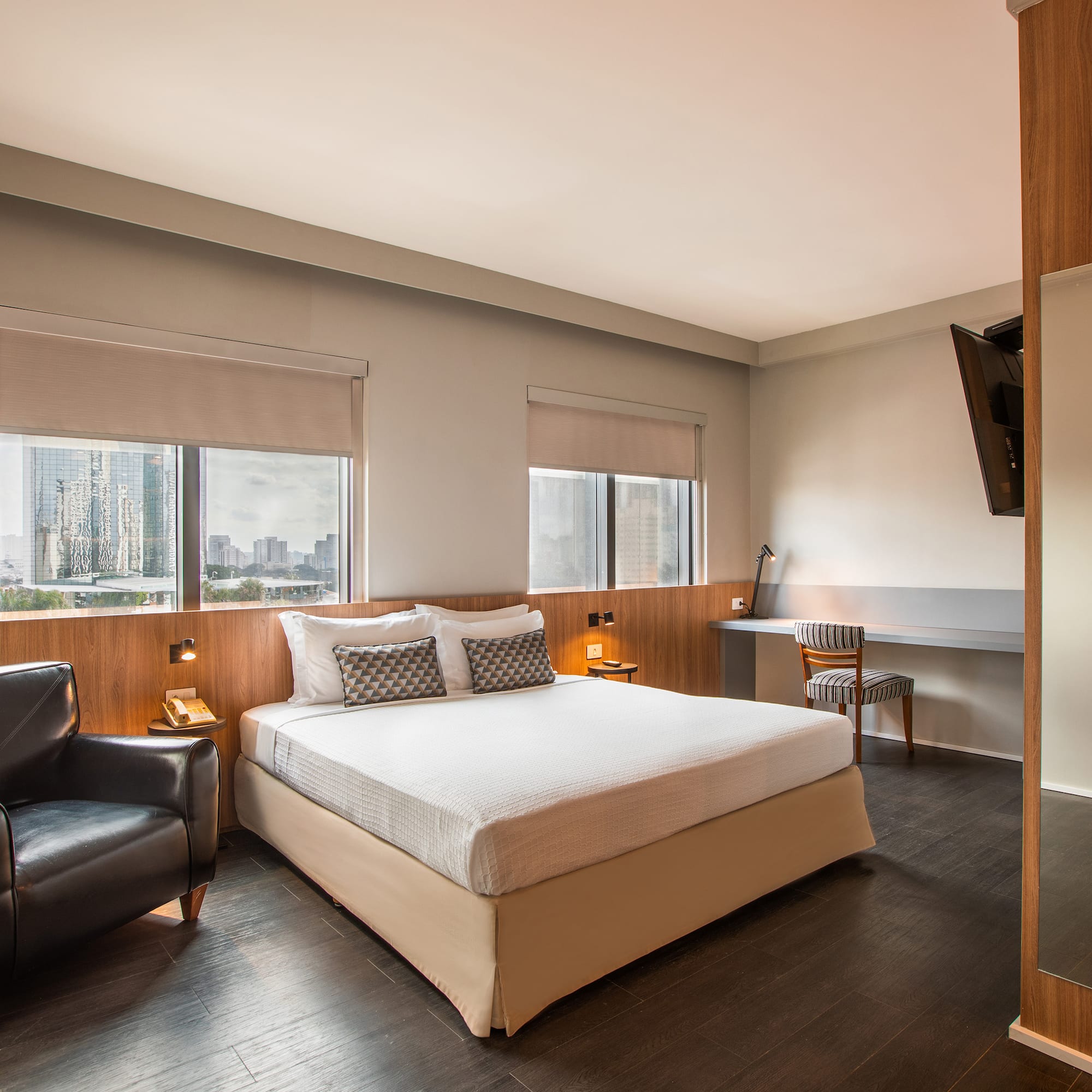 a room with a bed and a chair