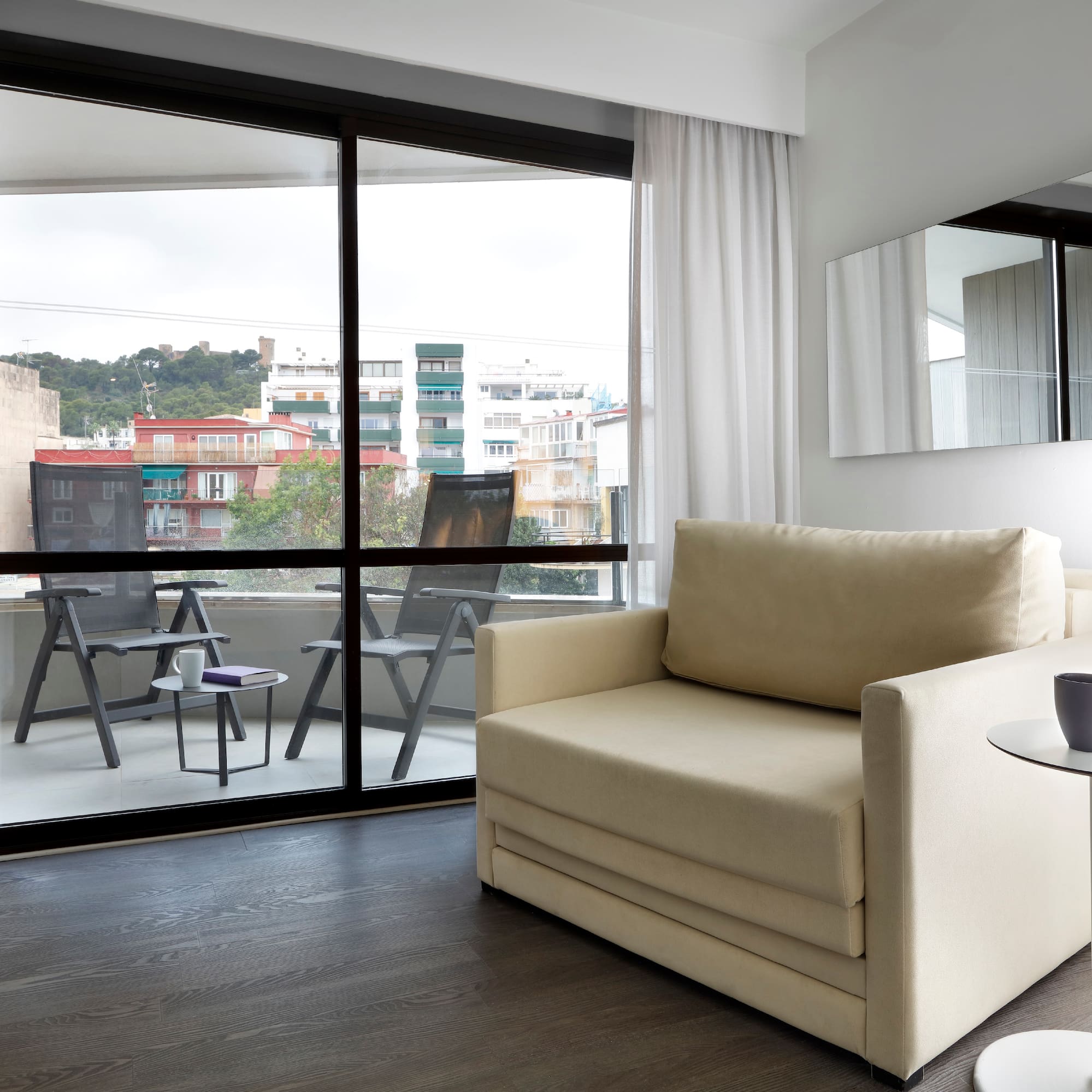 a living room with a couch and a glass door