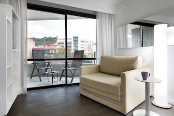 a living room with a couch and a glass door