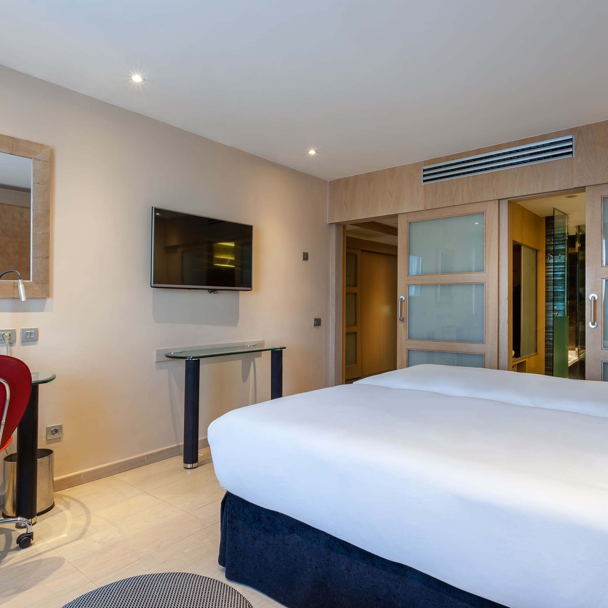 a room with a bed and a desk