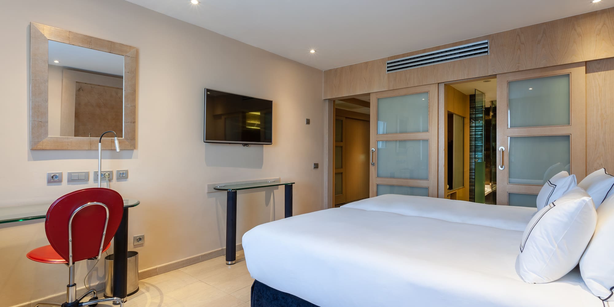 a room with a bed and a desk