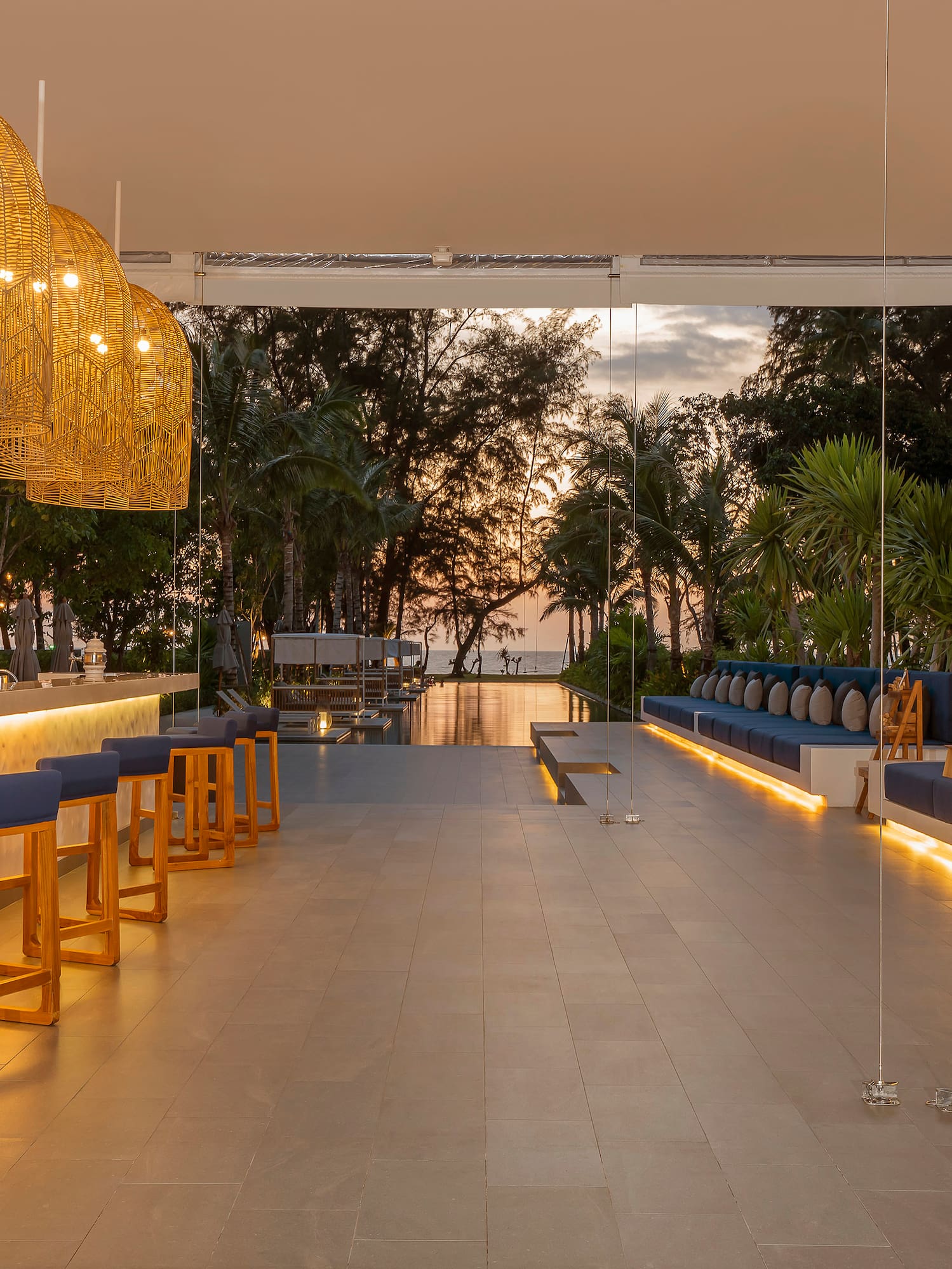 a room with a bar and chairs