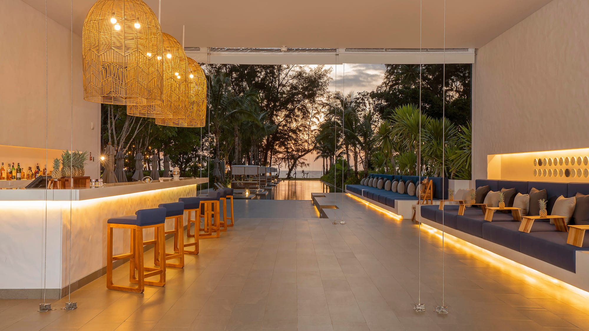 a room with a bar and chairs