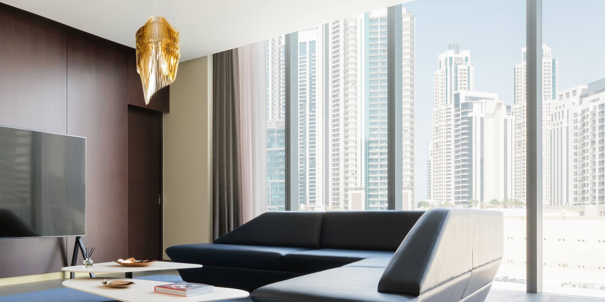 a living room with a large window and a couch