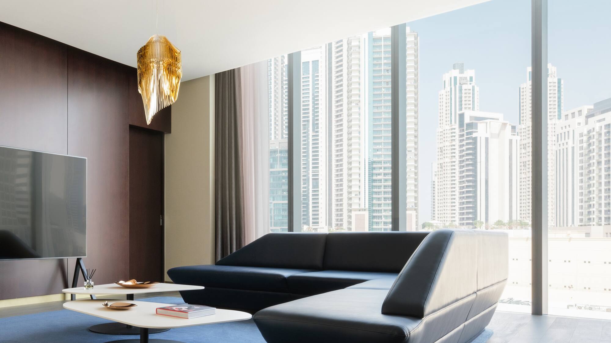 a living room with a large window and a couch