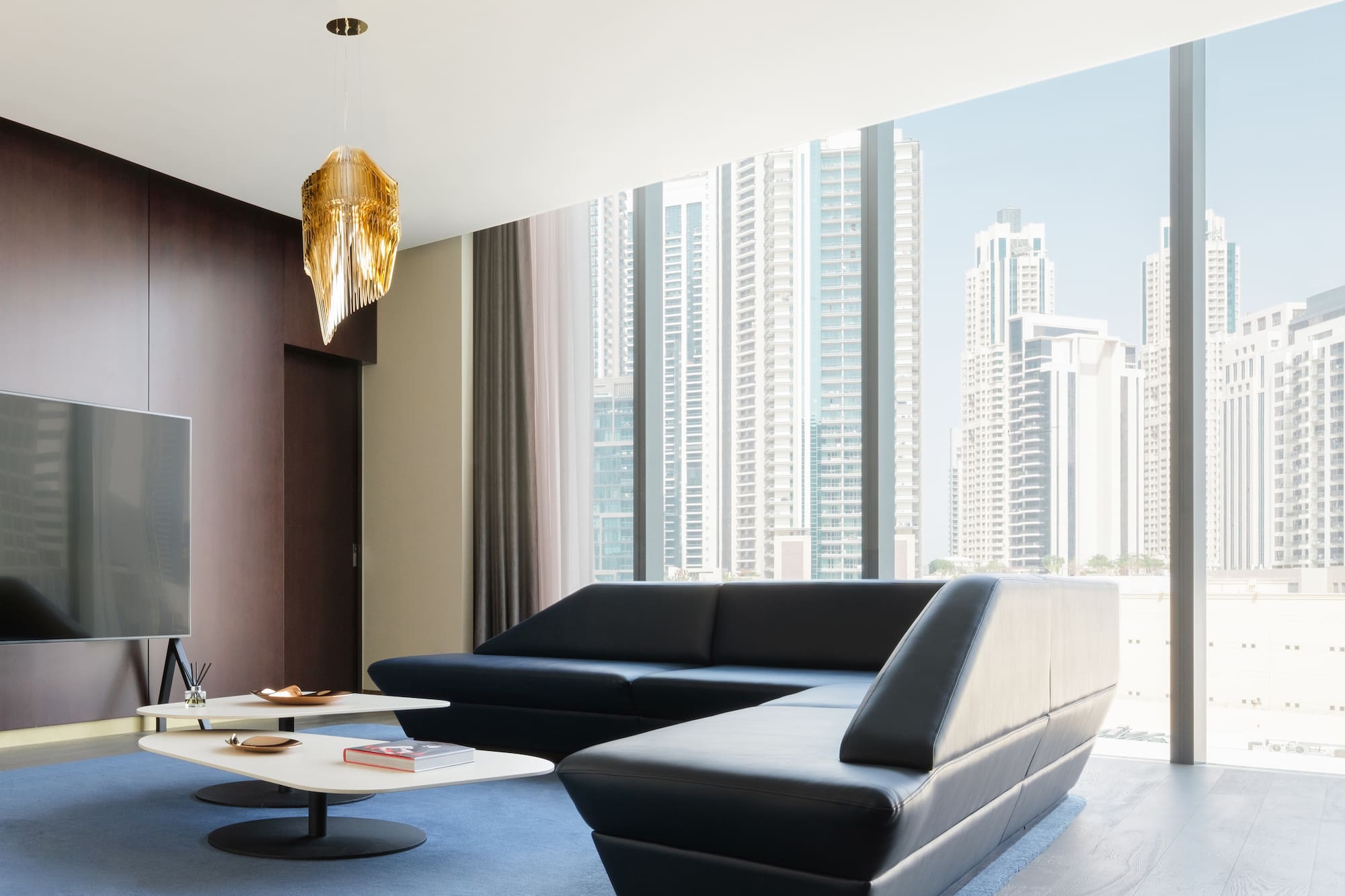 a living room with a large window and a couch