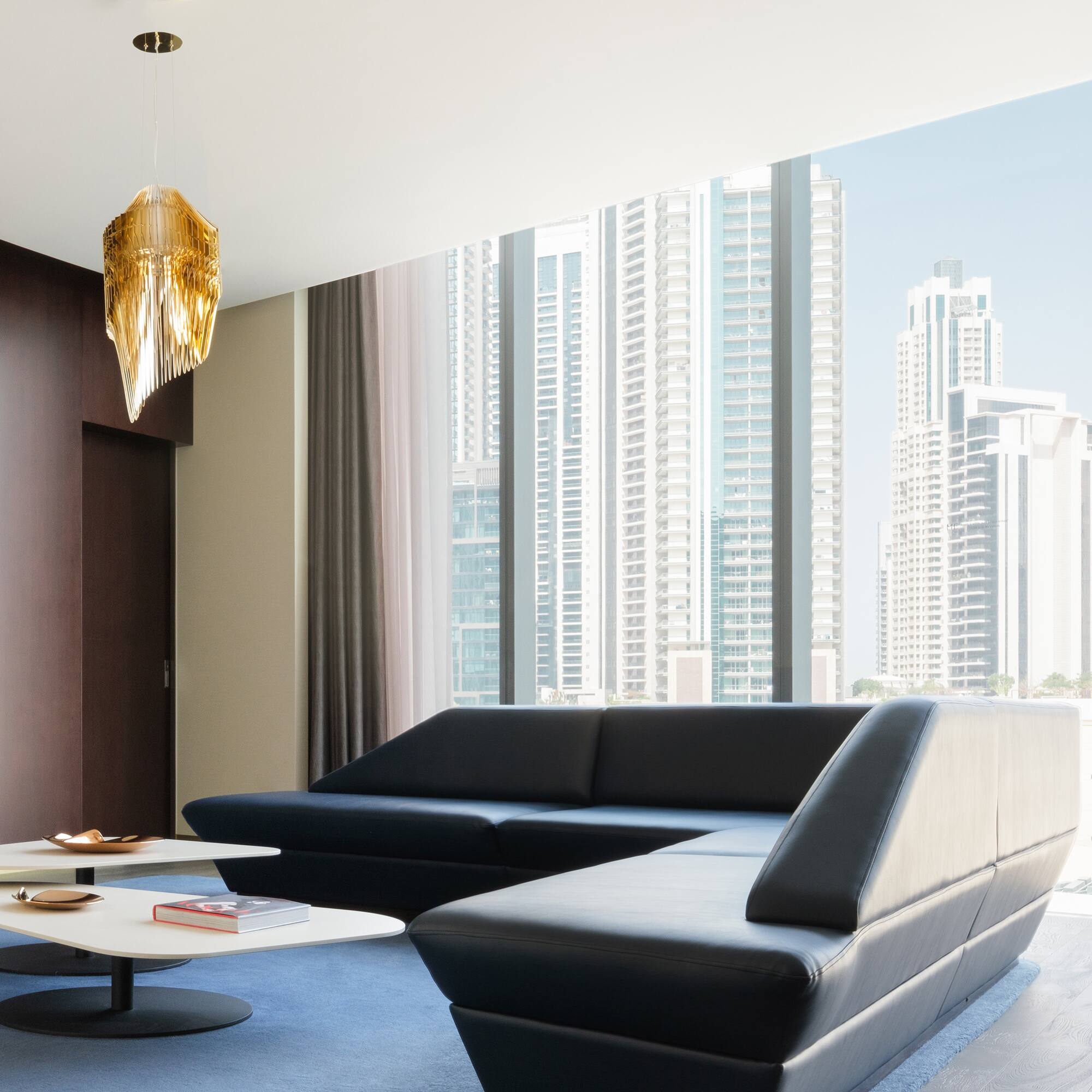 a living room with a large window and a couch