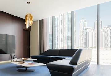 a living room with a large window and a couch