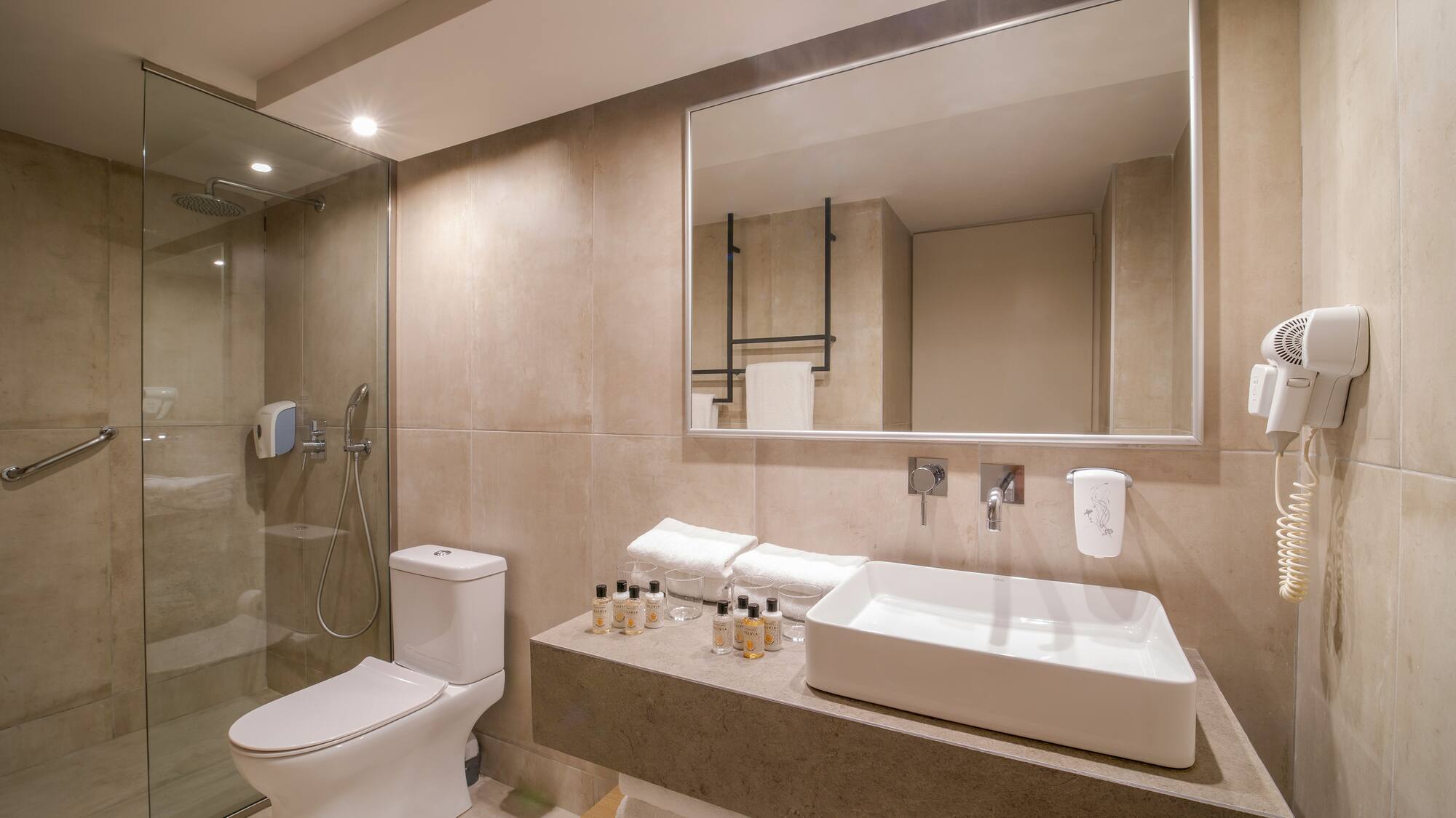 a bathroom with a mirror and sink