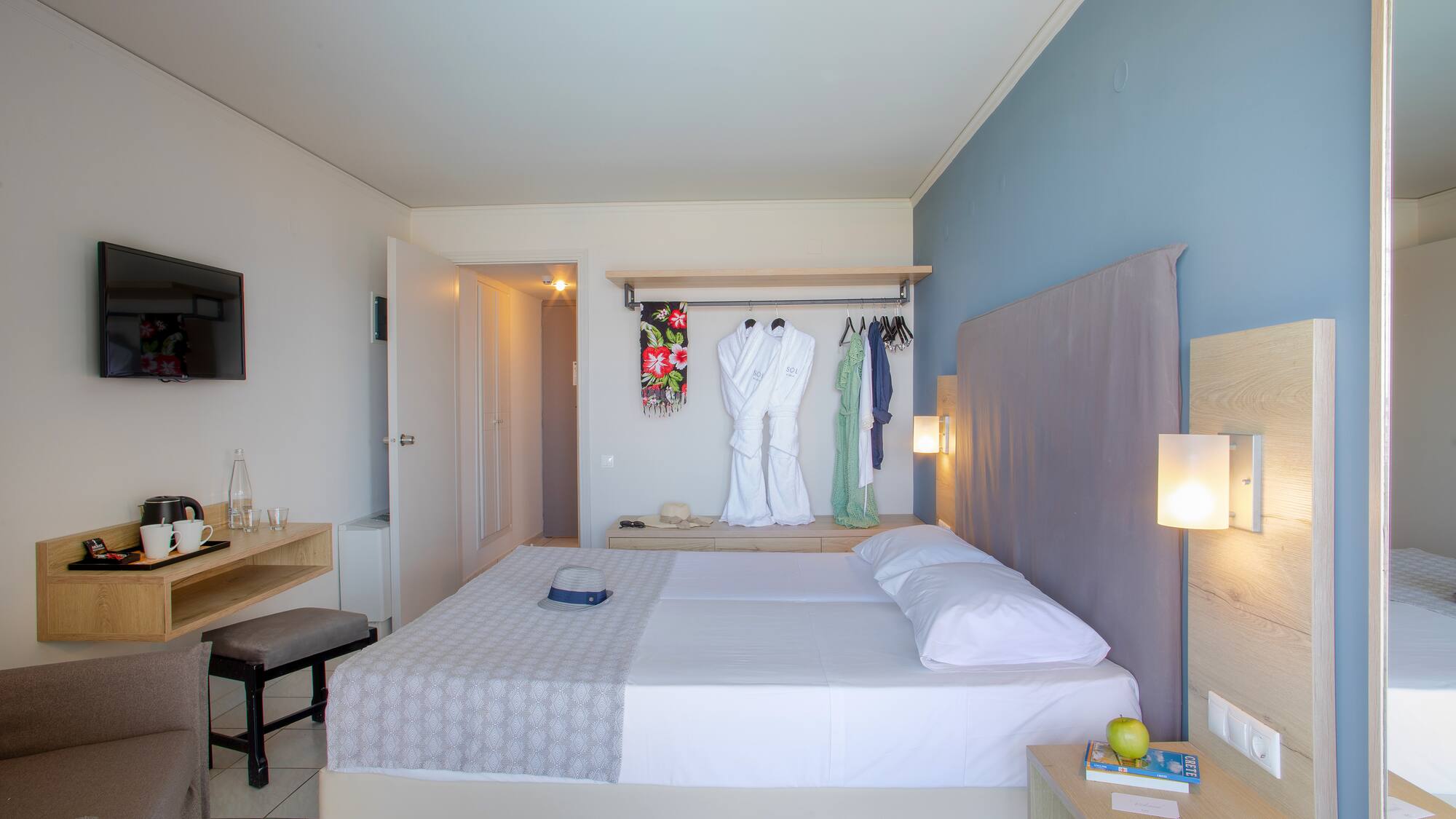 a bedroom with a bed and a mirror