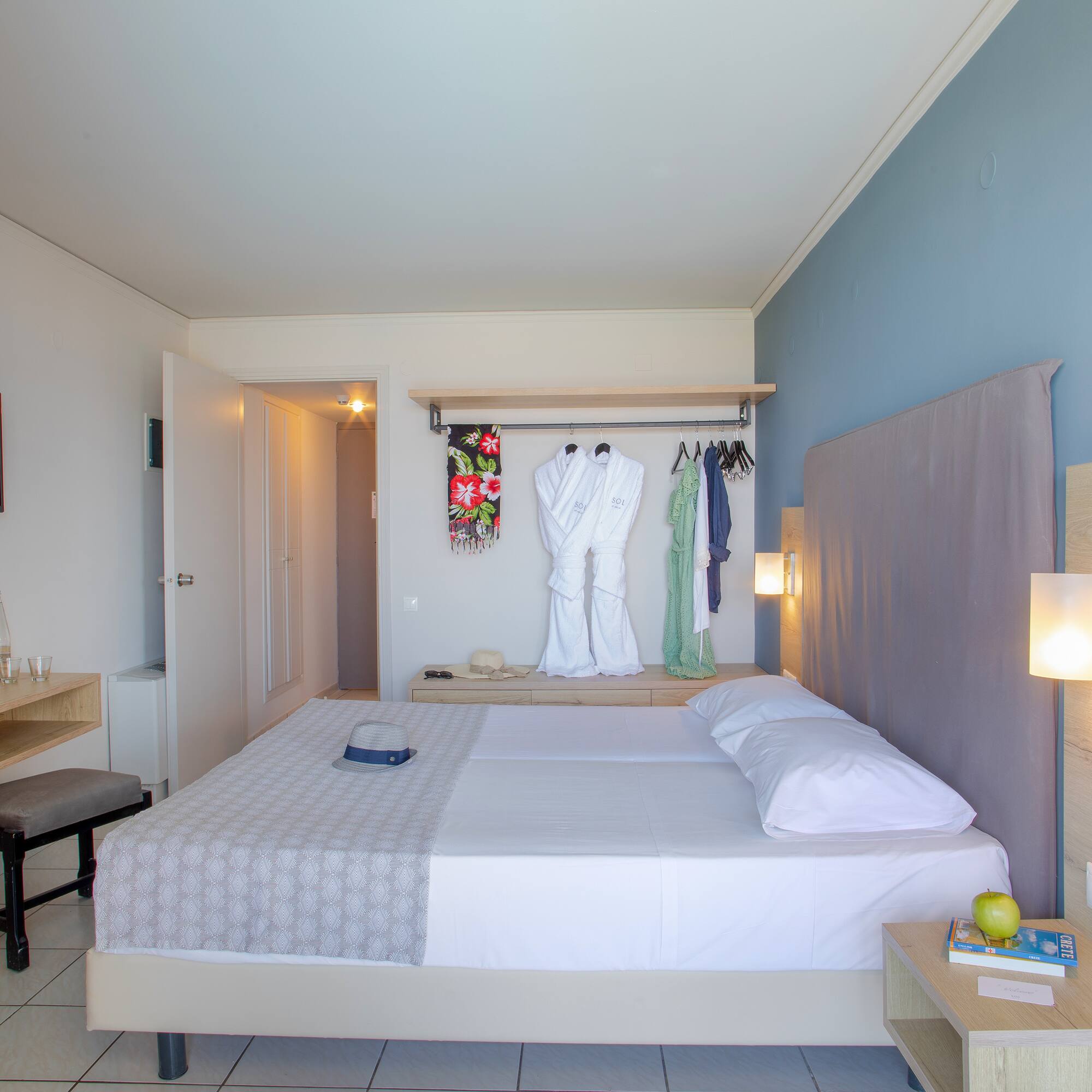 a bedroom with a bed and a mirror